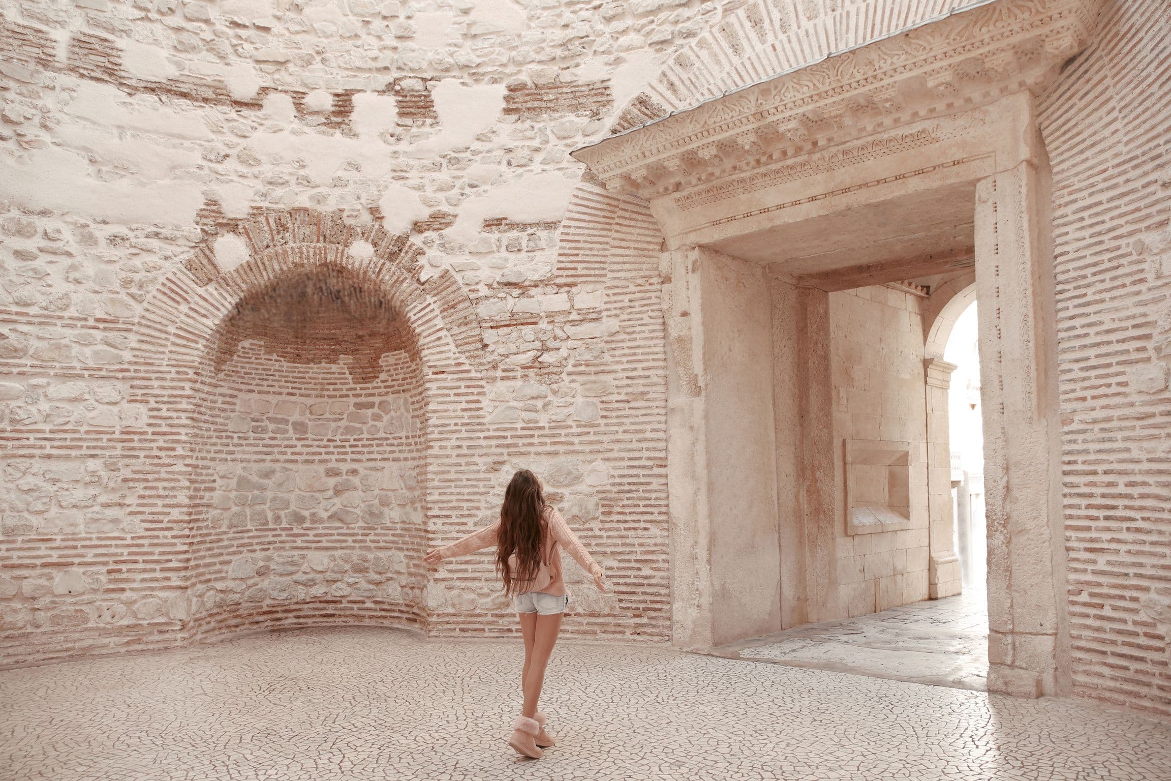 split old town woman standing in ancient building