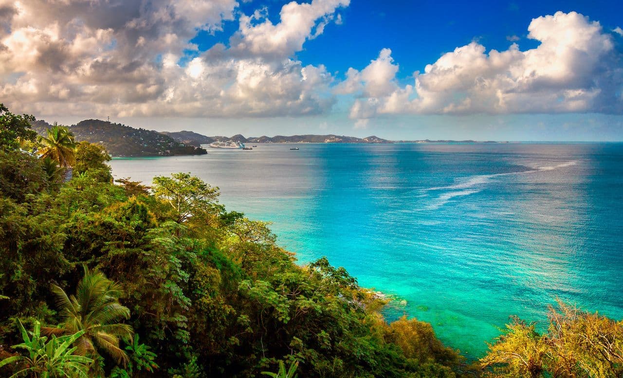 mal bay grenada caribbean coastline lush forest turquoise water scenic view