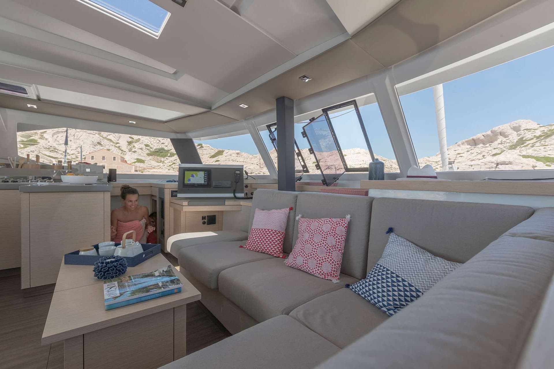 Spacious salon with steps down to the starboard suite