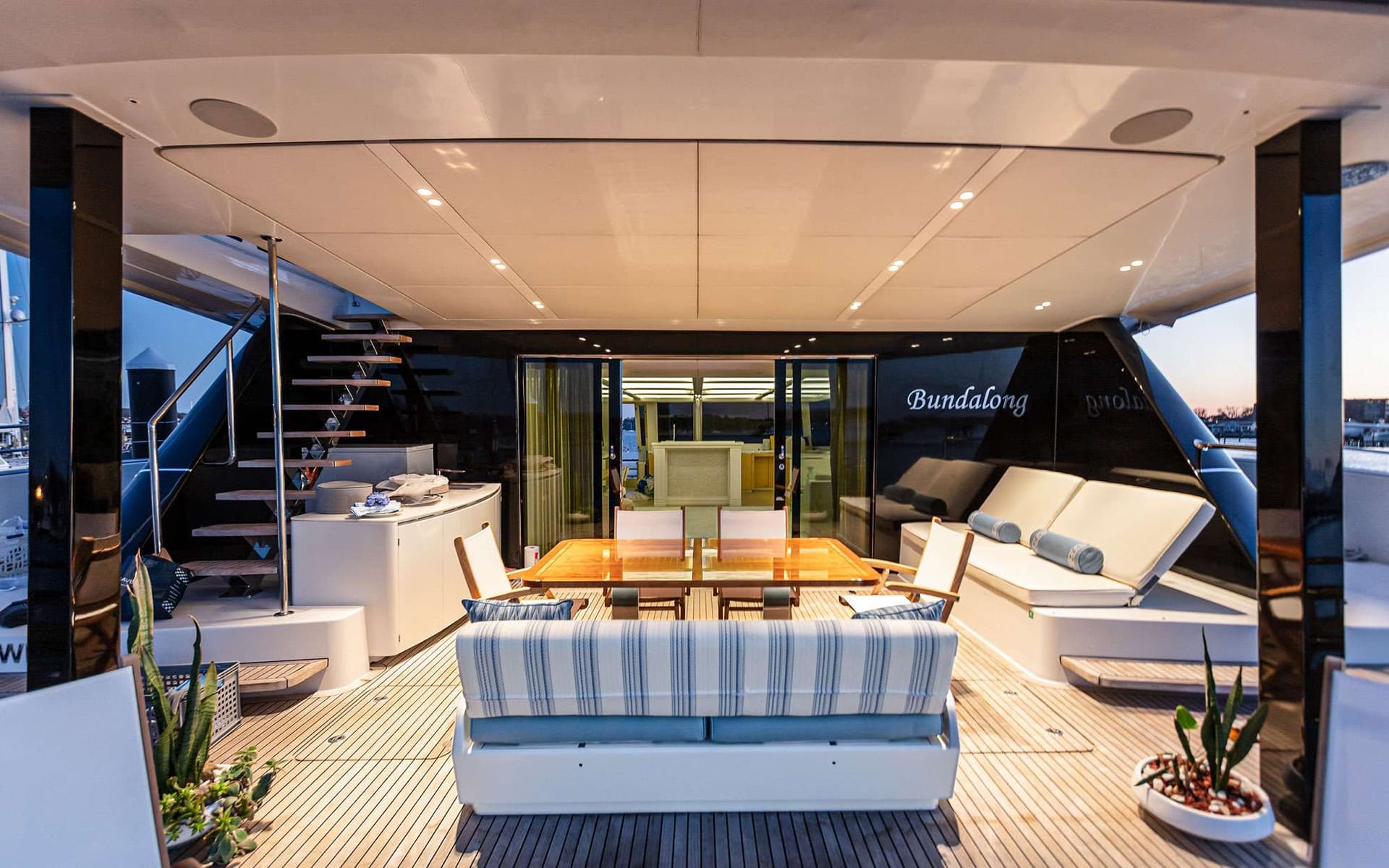 BUNDALONG has a cozy main deck aft for sheltered dining and lounging