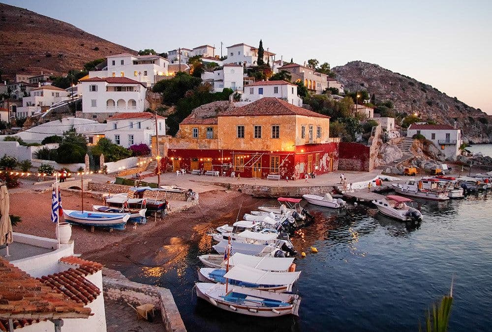 limin idhras hydra boats moored houses mountain greece