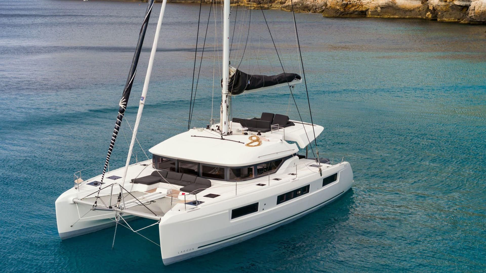 lagoon 50 bareboat catamaran full shot in a bay