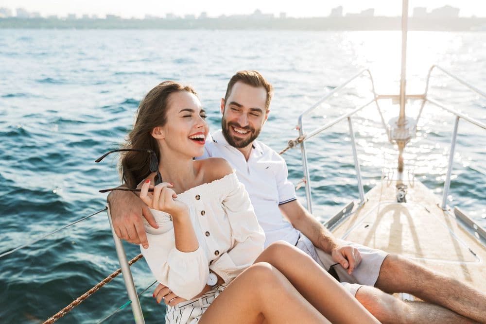 smiling couple on yacht