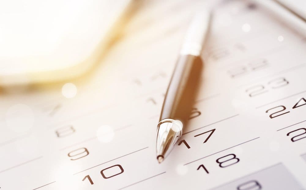 calendar with pen on it