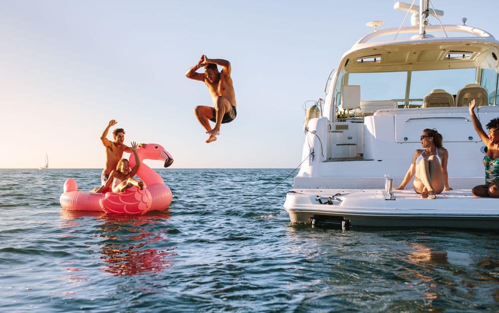 jumping off powerboat inflatable pink flamingo