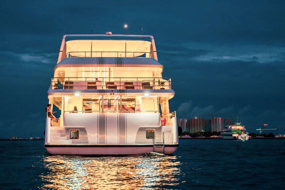 alice exterior back of boat at night