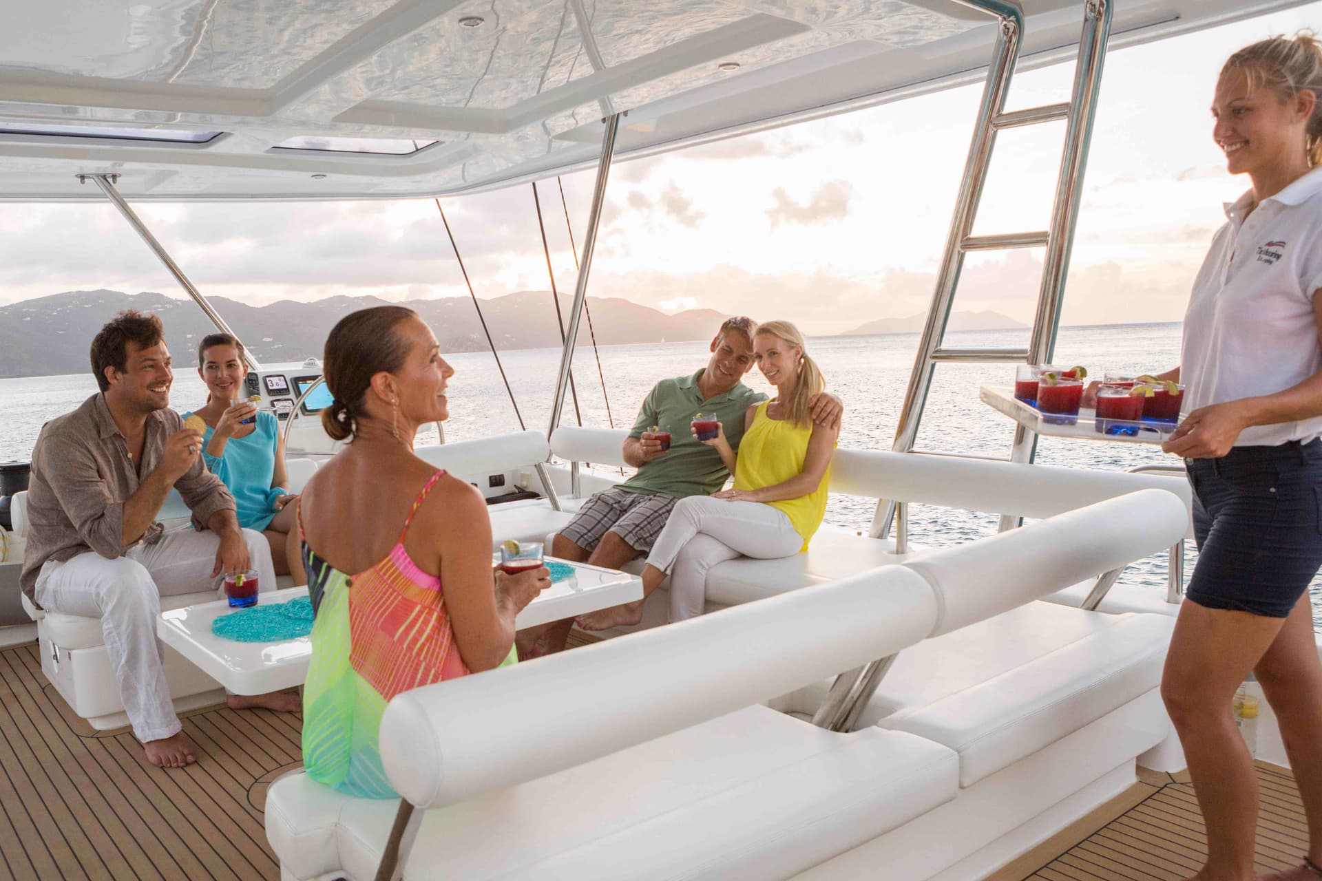 hostess serving drinks on flybridge