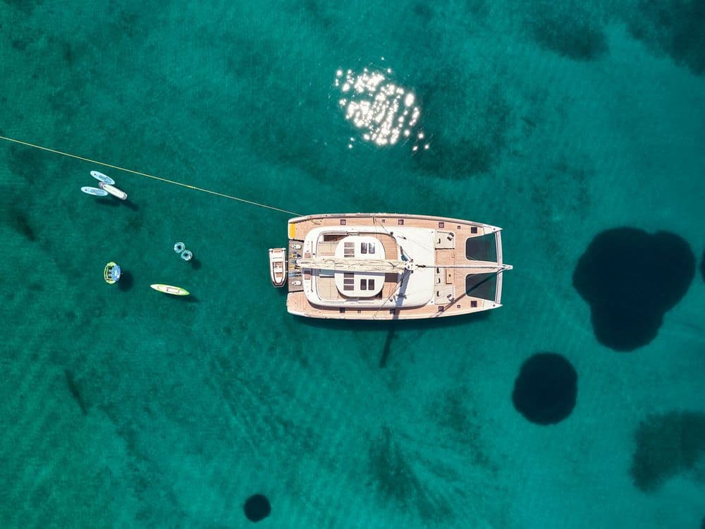 above and beyond greece crewed exterior drone shot