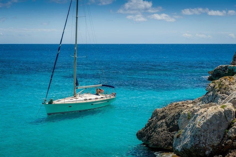 Boat with Blue Water and Rock