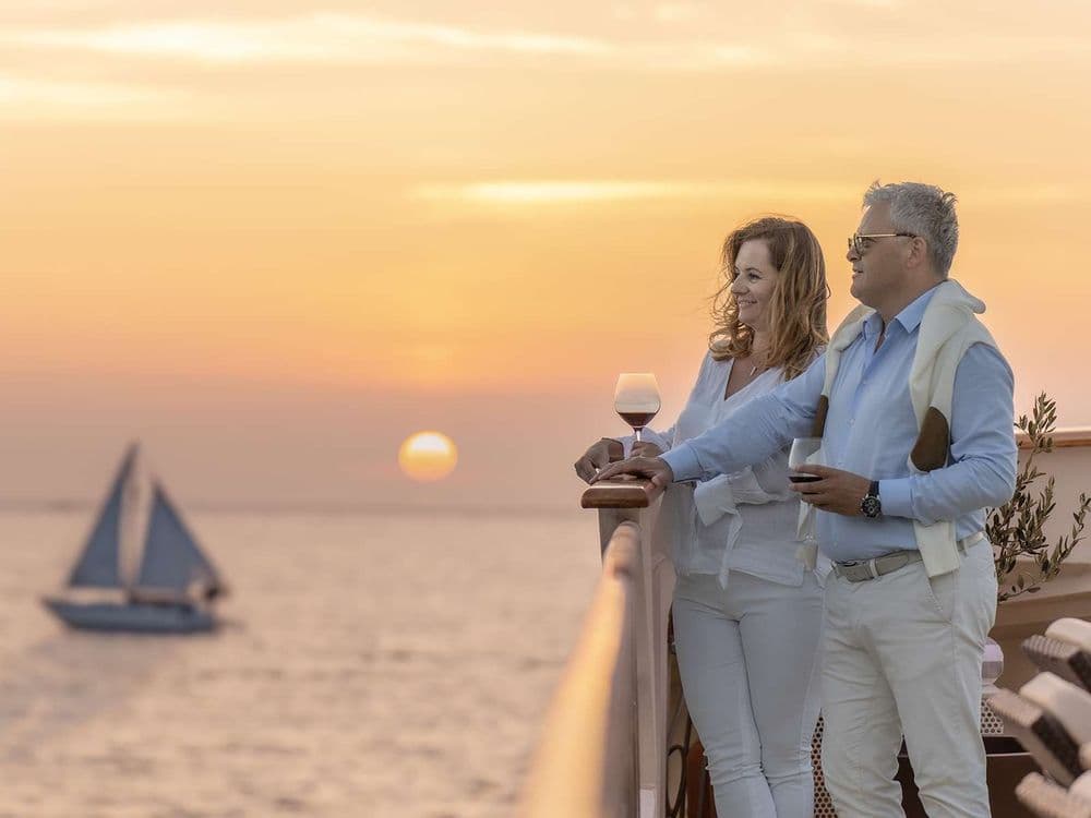 karizma-crewed-motor-yacht-sundowners-older-couple